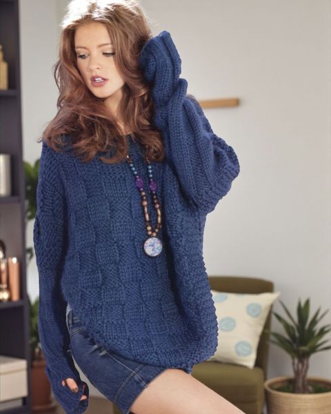 Poncho con maniche integrate